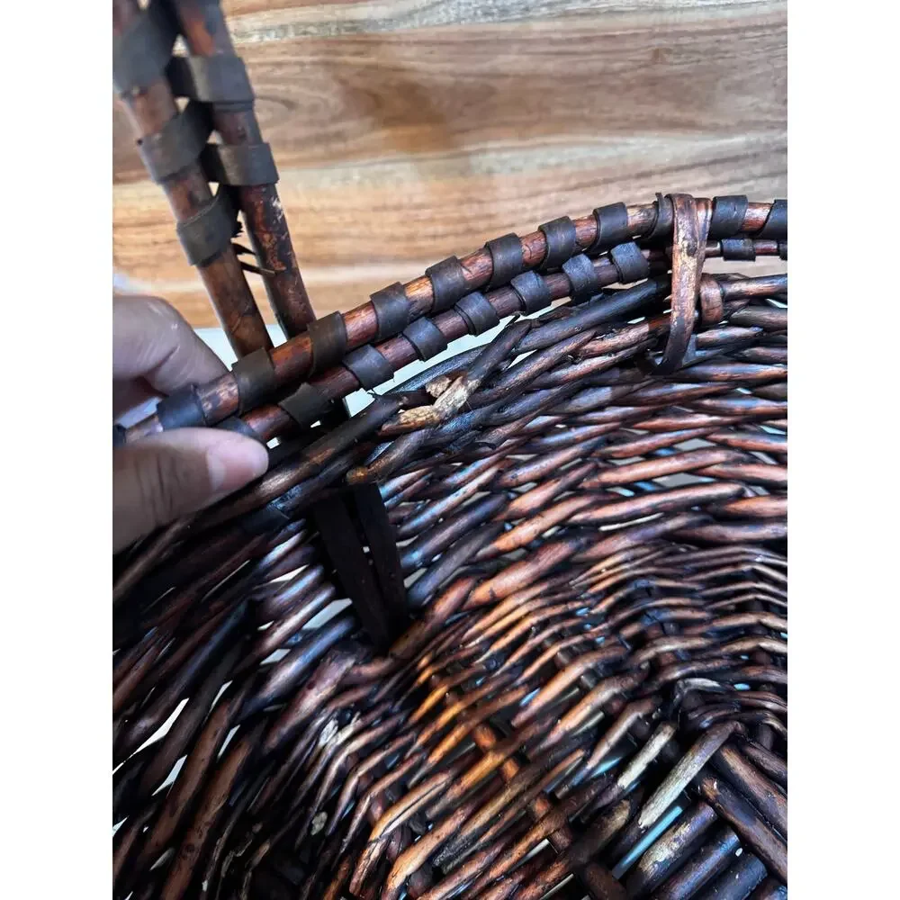 dark stained willow basket rustic handwoven texture sturdy center handle vintage